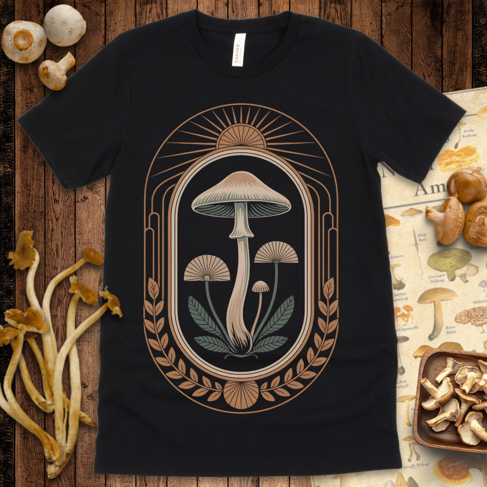 Ornate mushroom illustration framed by sun rays and laurel leaves in a vintage art deco and botanical style on black background