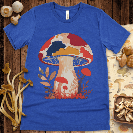 Illustrated mushroom with a bold red, orange, and navy cap, surrounded by abstract fall leaves and grass on a black background
