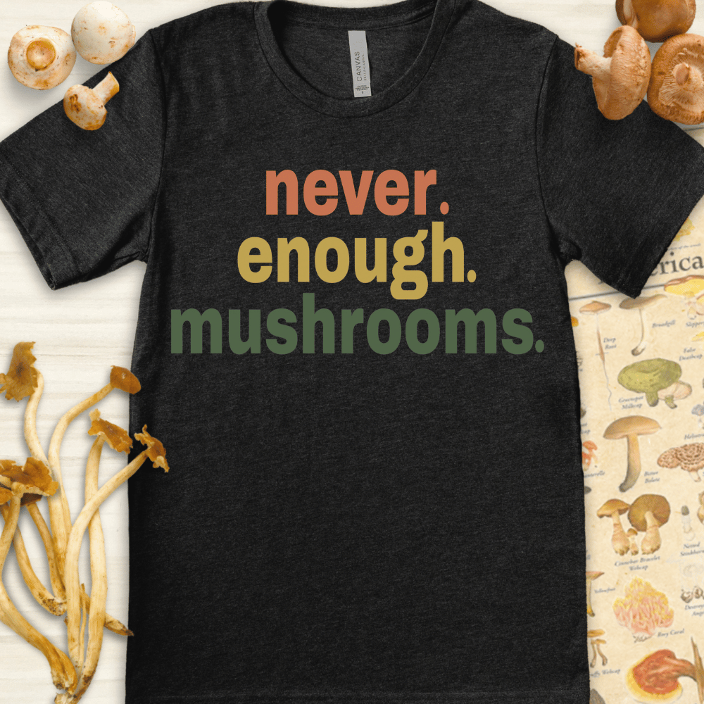 Colorful “never enough mushrooms” quote on a bold graphic T-shirt design in earthy tones