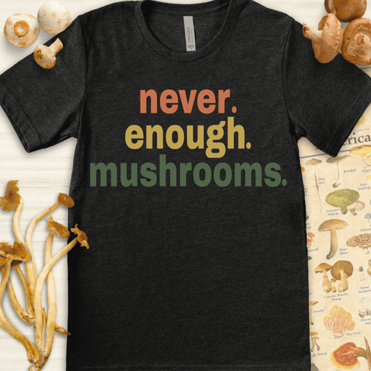 Colorful “never enough mushrooms” quote on a bold graphic T-shirt design in earthy tones