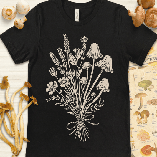 Vintage-style illustration of a tied bouquet made of wildflowers and mushrooms on a black background, hand-drawn in a soft natural tone.