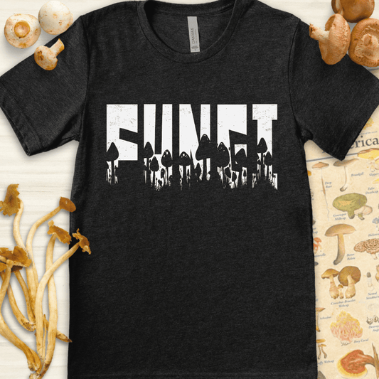 Black and white graphic T-shirt design featuring the word "FUNGI" filled with silhouettes of various mushroom species beneath it.