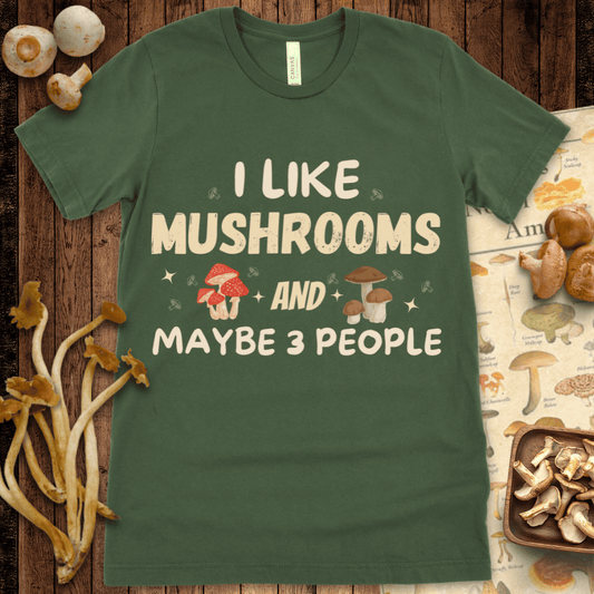 Text reads “I Like Mushrooms and Maybe 3 People” with illustrated mushrooms, sparkles, and playful typography on a black background