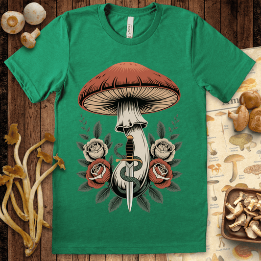 Tattoo-style mushroom above a dagger wrapped in a snake, surrounded by roses and leaves in a bold, vintage-inspired design on black background