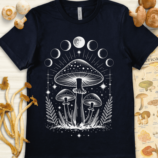 White illustration of glowing mushrooms surrounded by moon phases and stars on a black background in a mystical, celestial style.