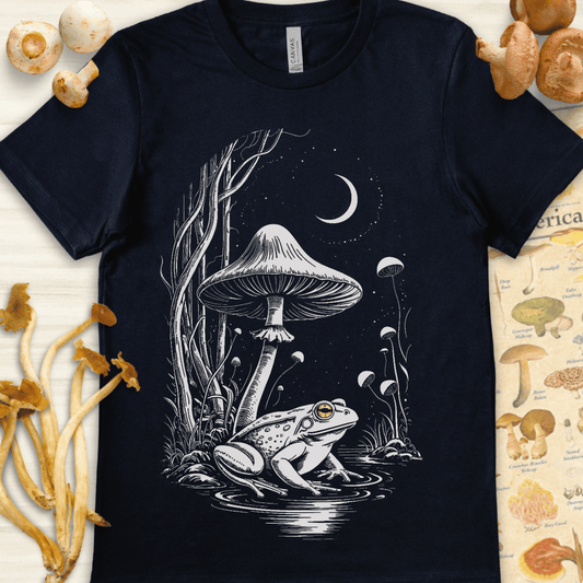 Fantasy-style illustration of a frog with glowing golden eyes under a large mushroom and crescent moon in a mystical forest scene.
